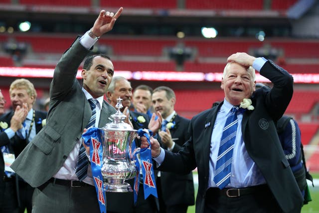 Wigan manager Roberto Martinez (left) and chairman Dave Whelan celebrate an unlikely FA Cup final victory over Manchester City (Anthony Devlin/PA)