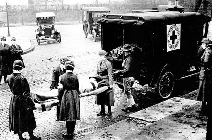 An ambulance in St Louis, Missouri, picks up a patient believed to be infected with influenza during the 1918-19 Spanish flu pandemic