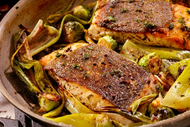 <p>Make this as weeknight friendly as possible by roasting the fish and leeks in the same pan</p>