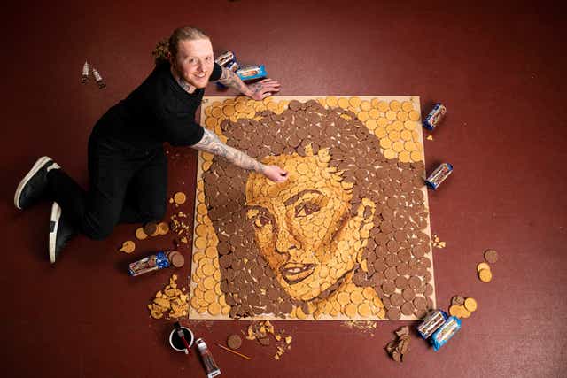 Food artist Nathan Wyburn with his biscuit portrait of Alesha Dixon (Adam Gasson/PA)