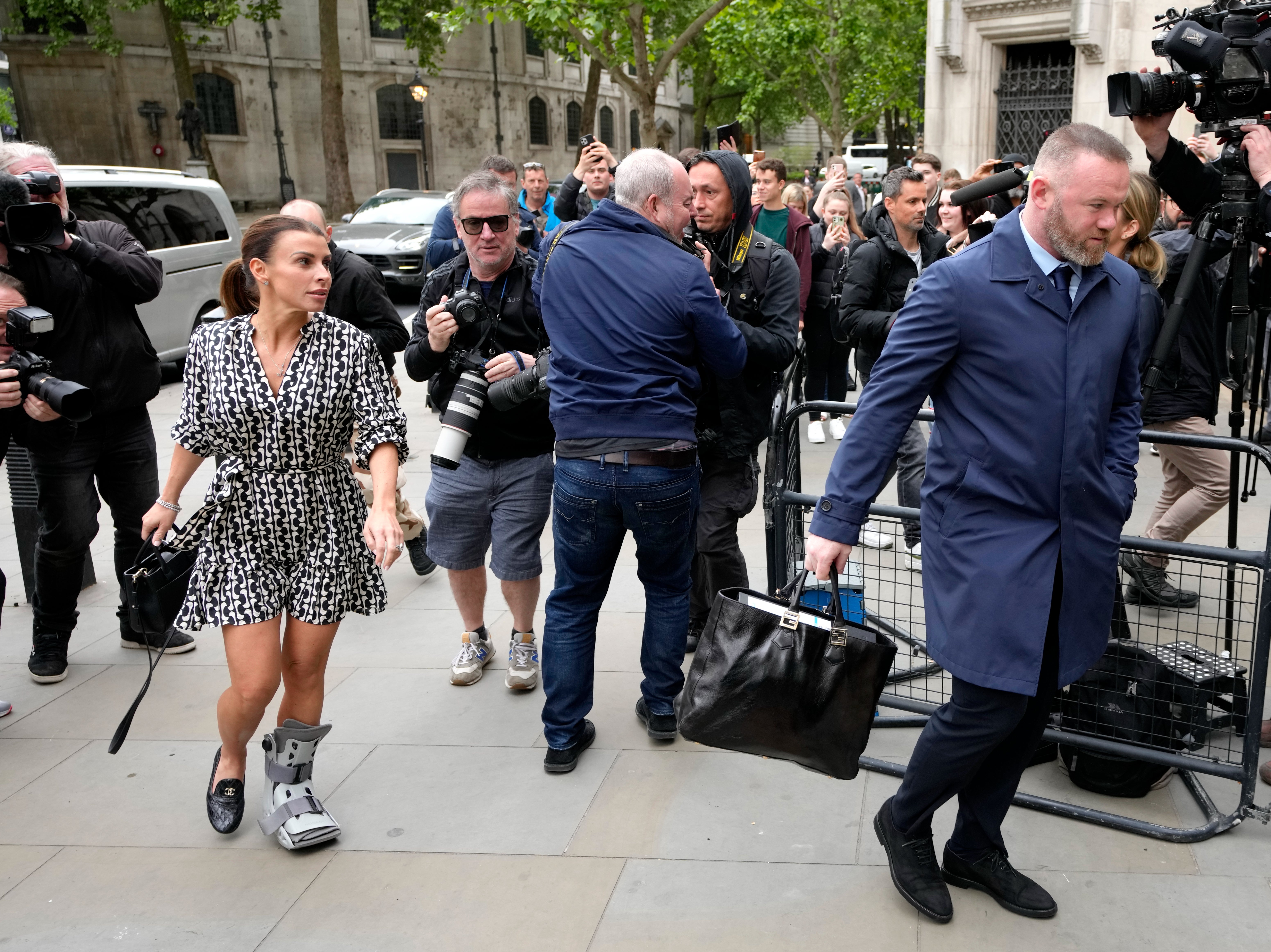 Coleen Rooney and her husband Wayne arrive at the High Court in London for the second day of the libel hearing