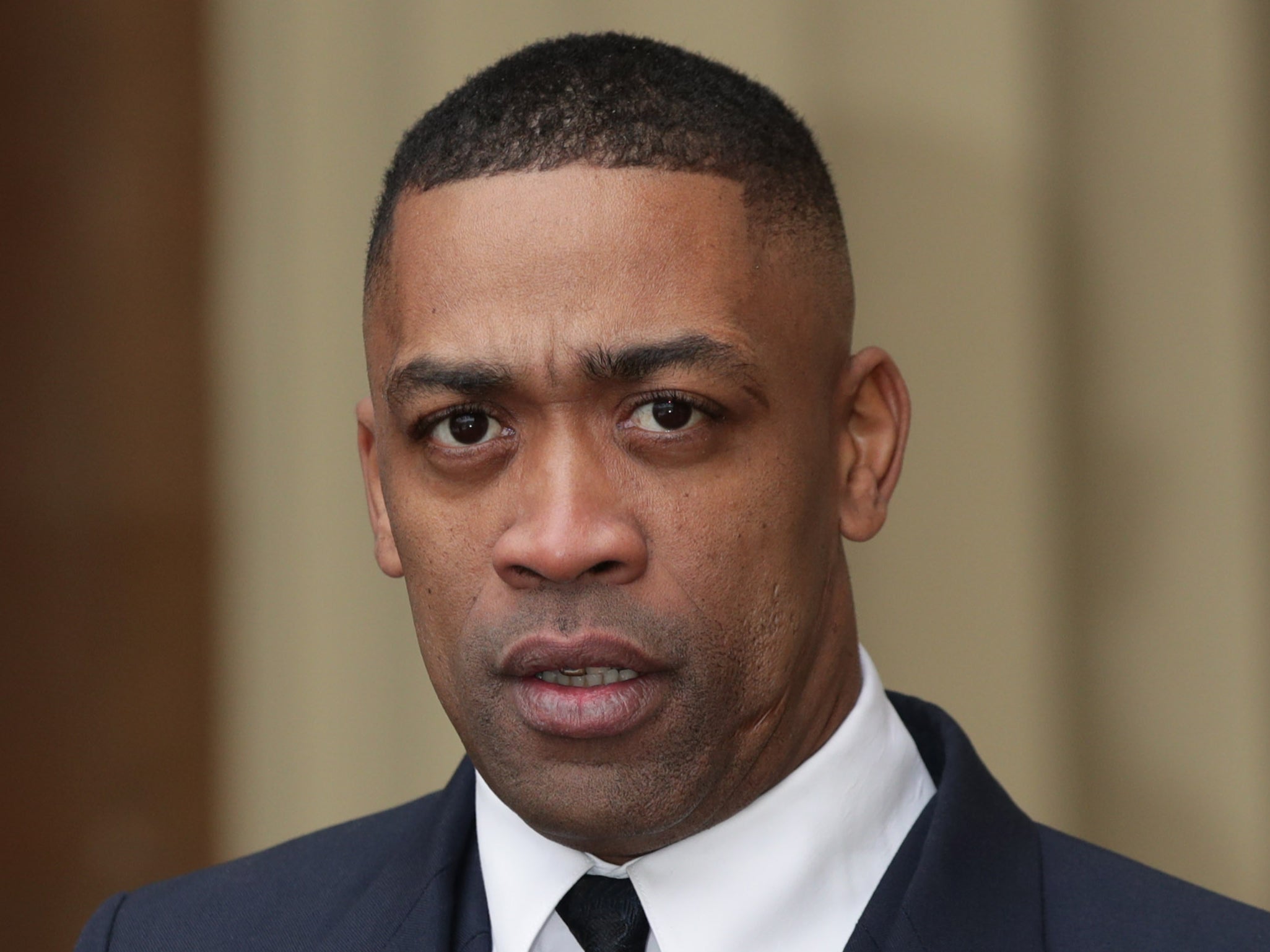 Musician Wiley, also known as Richard Cowie Jnr, accepting an MBE in 2018