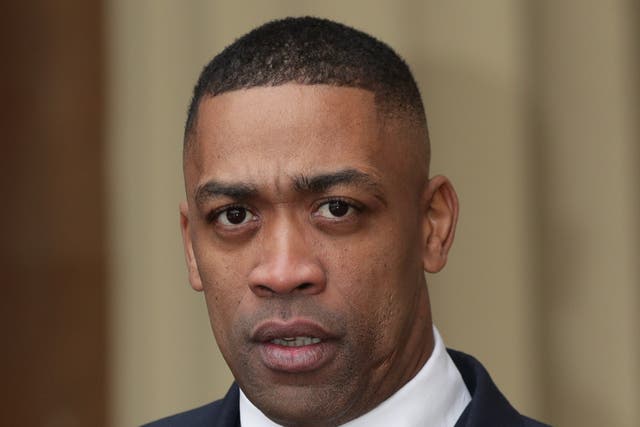 <p>Musician Wiley, also known as Richard Cowie Jnr, accepting an MBE in 2018</p>