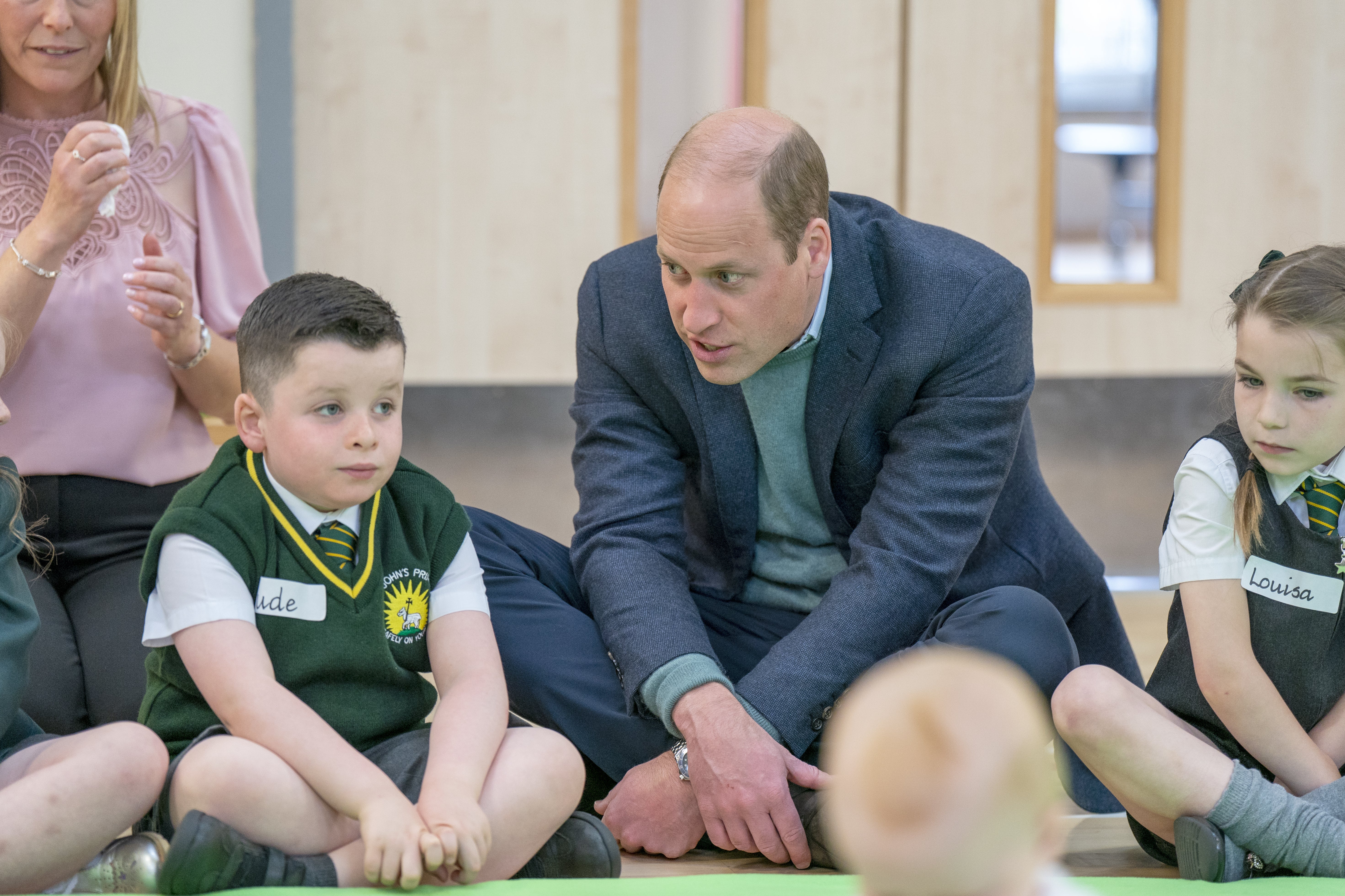 William chats to a little boy during the visit to the primary school (Jane Barlow/PA)