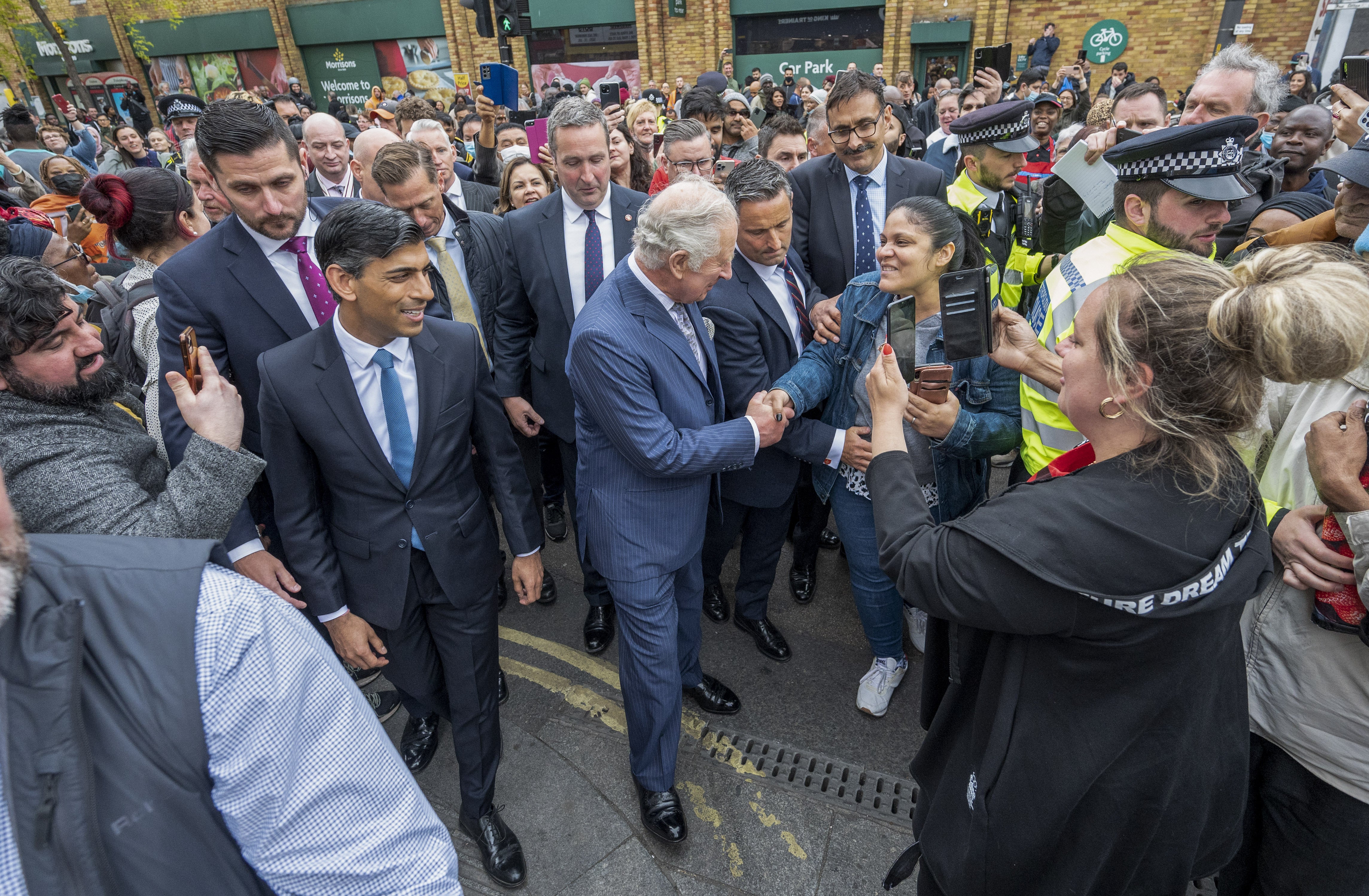 The Prince of Wales, accompanied by Chancellor Rishi Sunak meeting the public in Walworth, London (Paul Grover/Daily Telegraph/PA)