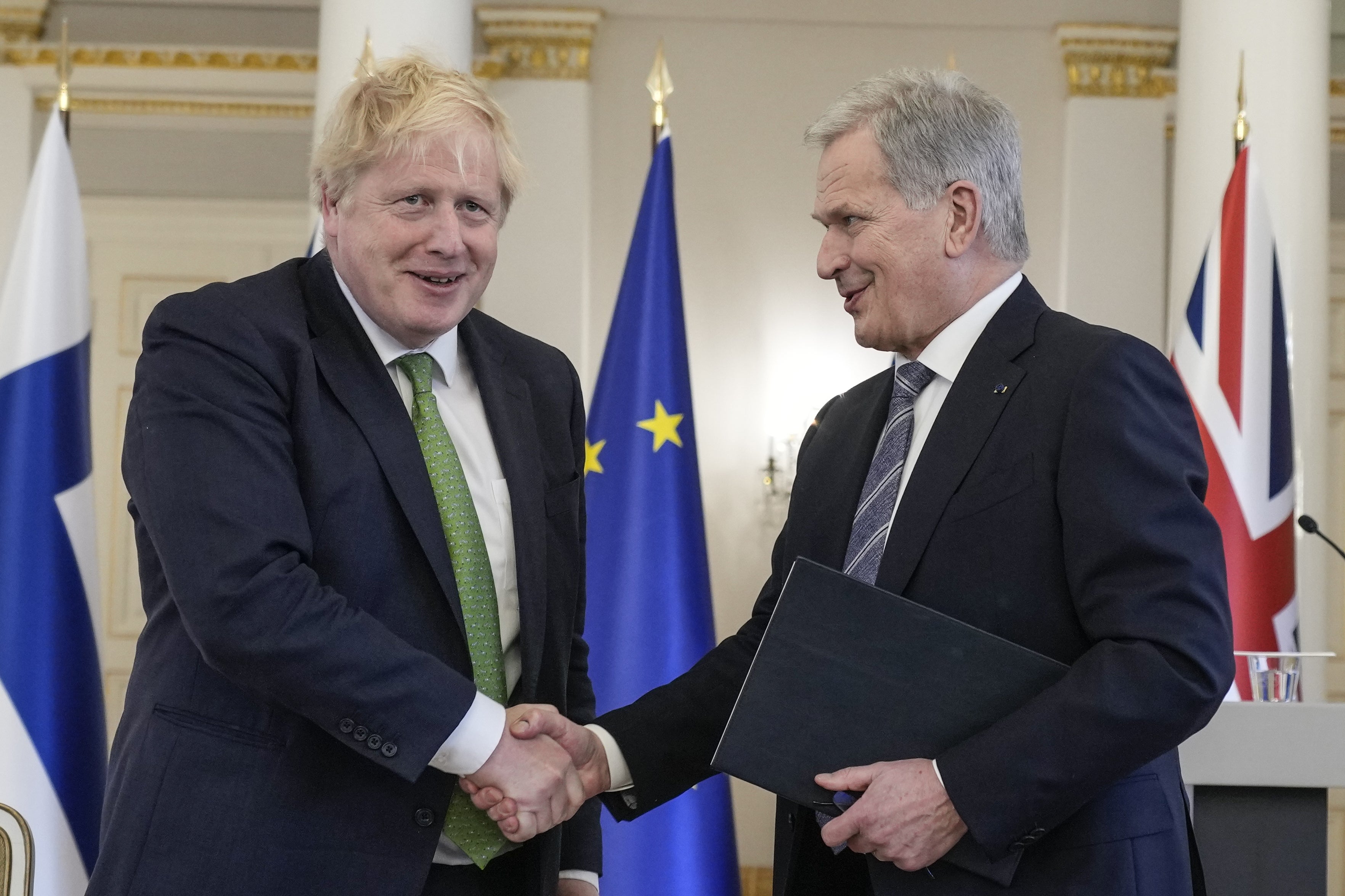 Prime Minister Boris Johnson (left) and Finland’s President Sauli Niinisto, shake hands after signing a security assurance (Frank Augstein/PA)