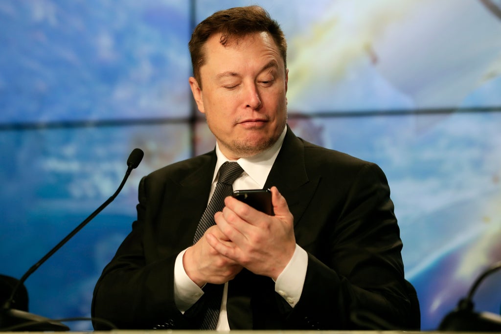 Elon Musk says Twitter deal is on hold until he gets more information about fake accounts