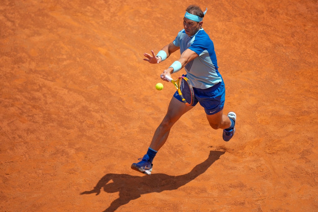 Rafael Nadal returns to winning ways on clay with Rome victory over John Isner