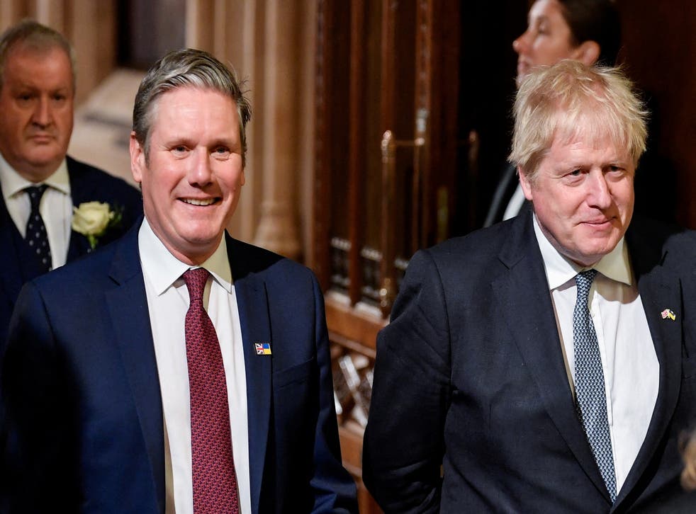 Prime Minister Boris Johnson (right) with the leader of the Labour Party Sir Keir Starmer walk through the Members’ Lobby at the Palace of Westminster ahead of the State Opening of Parliament in the House of Lords, London (Toby Melville/PA)