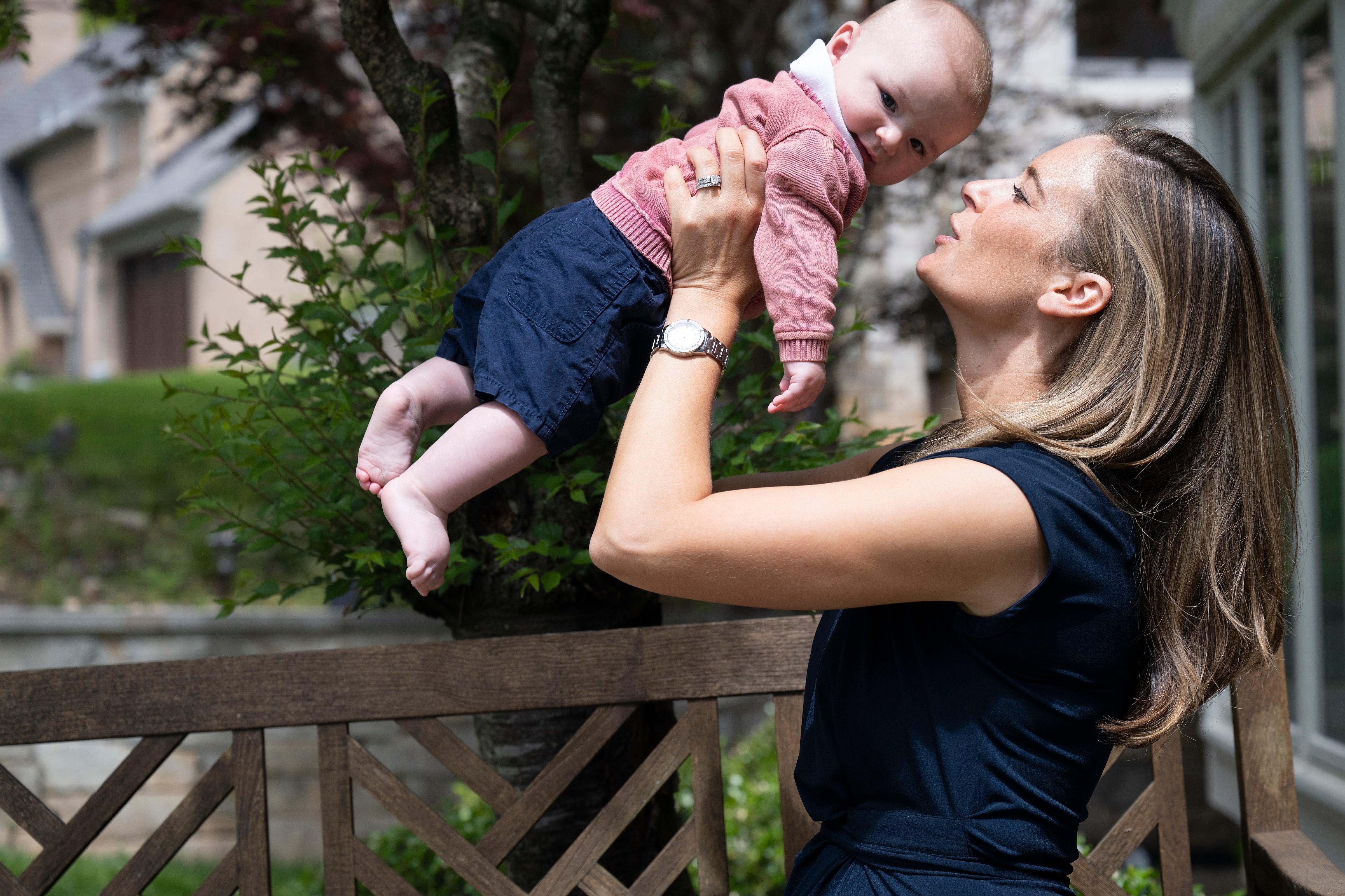 Lindsey Gill runs the The Napkin Network, which works with low-income families. Gill is searching for formula for families but also needs some for her 4-month-old son Dane, seen outside their home in Bethesda, Md., on Wednesday