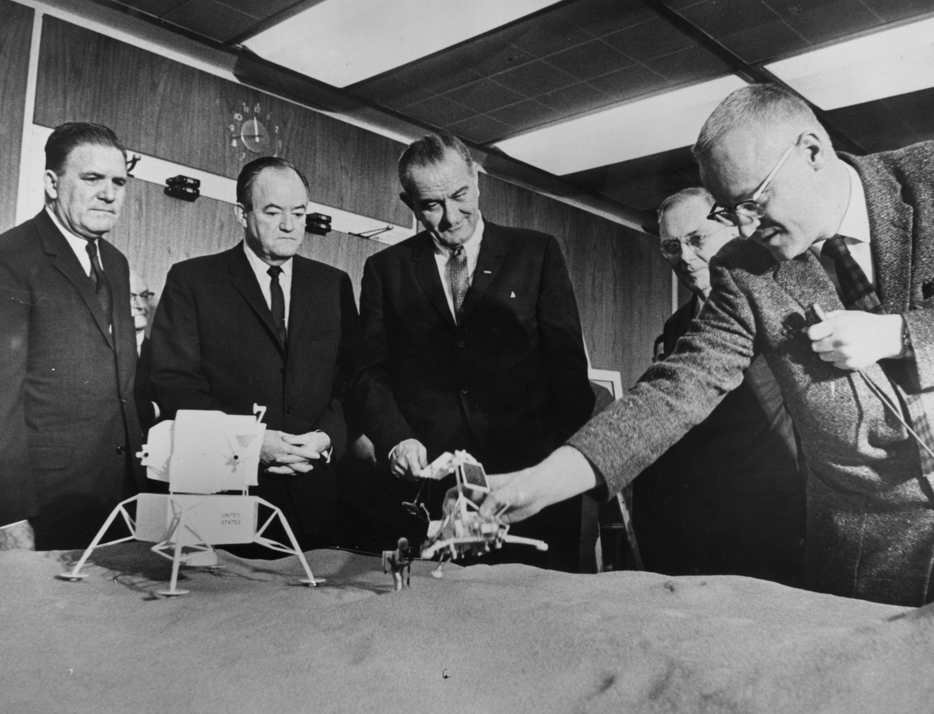 Webb (far left) was fortunate to have the almost unconditional support of President Johnson (centre)