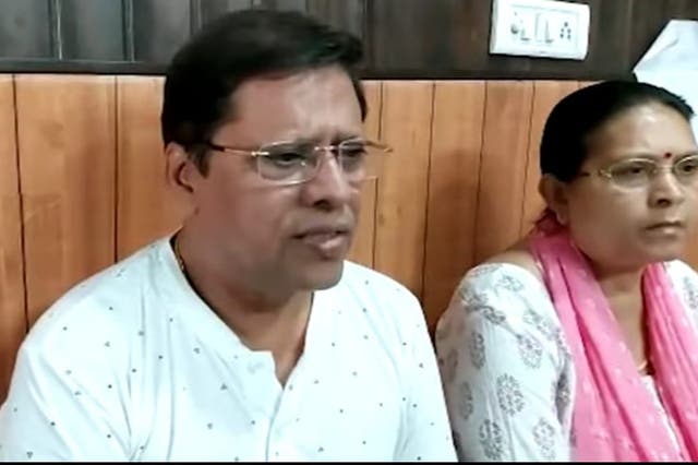 <p>Sanjiv Ranjan Prasad (left) and his wife Sadhana Prasad have moved court seeking compensation for a grandchild</p>