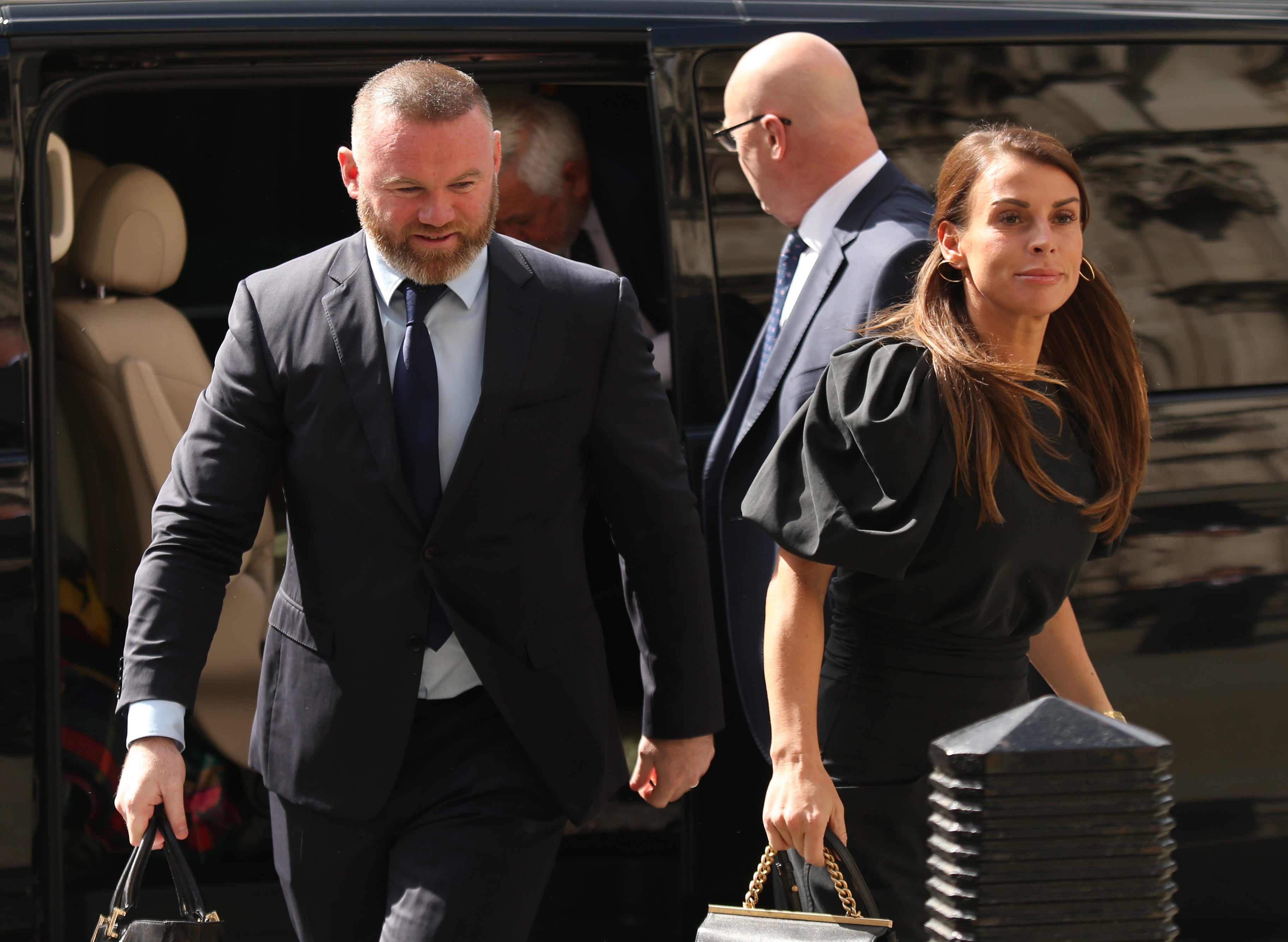 Coleen and Wayne Rooney arrive at the Royal Courts of Justice (James Manning/PA)