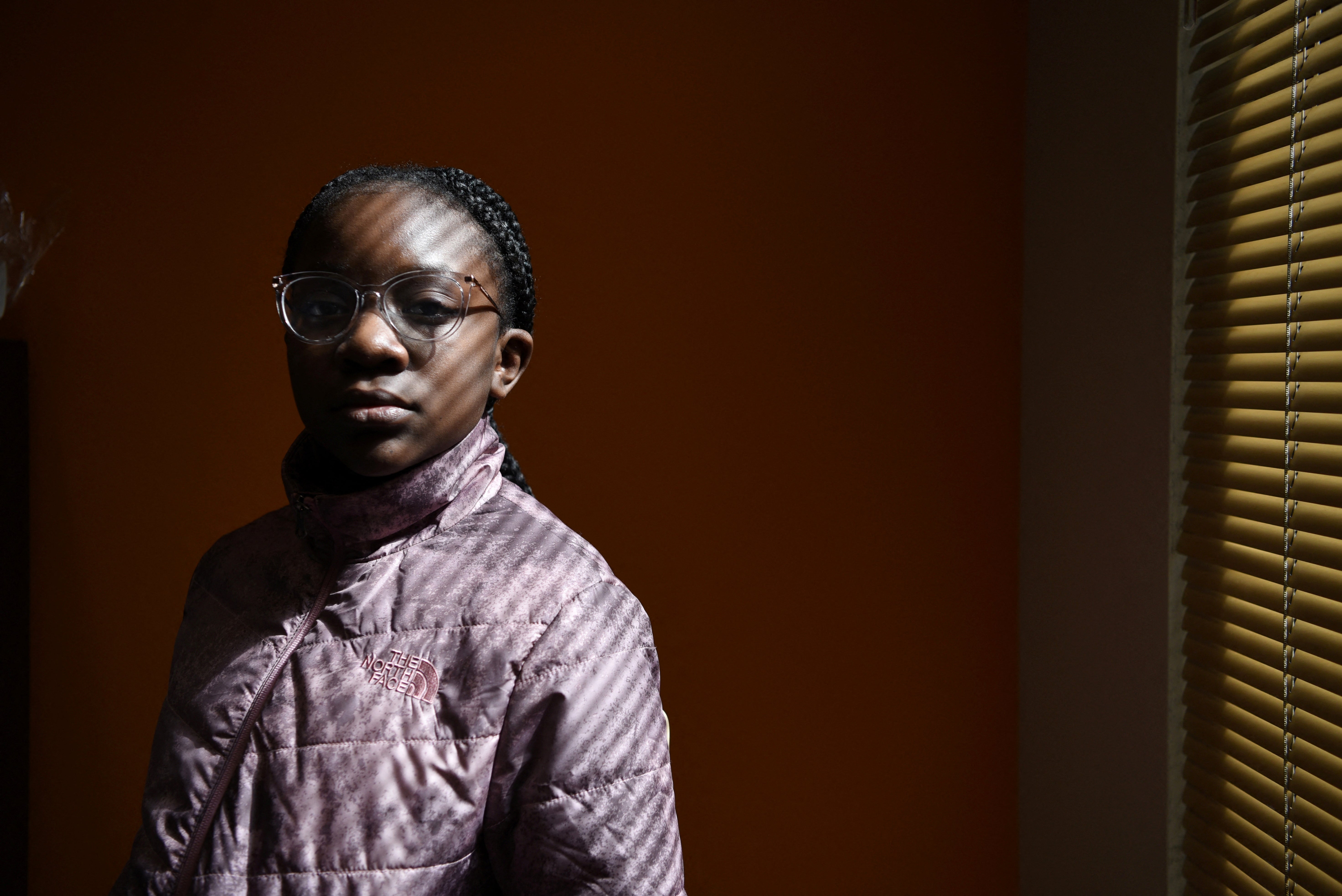 Justise McGowan whose father died from the coronavirus disease (COVID-19) in May 2020, poses for a portrait at her mother, Dr. Sandra McGowan-Watts', office in Flossmoor, Illinois