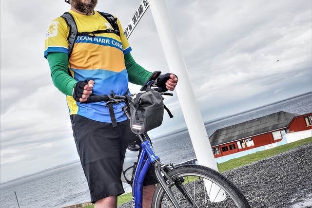 Stuart Jamieson made the journey from Land’s End to John O’Groats by scooter (Jim Stewart/Marie Curie/PA)
