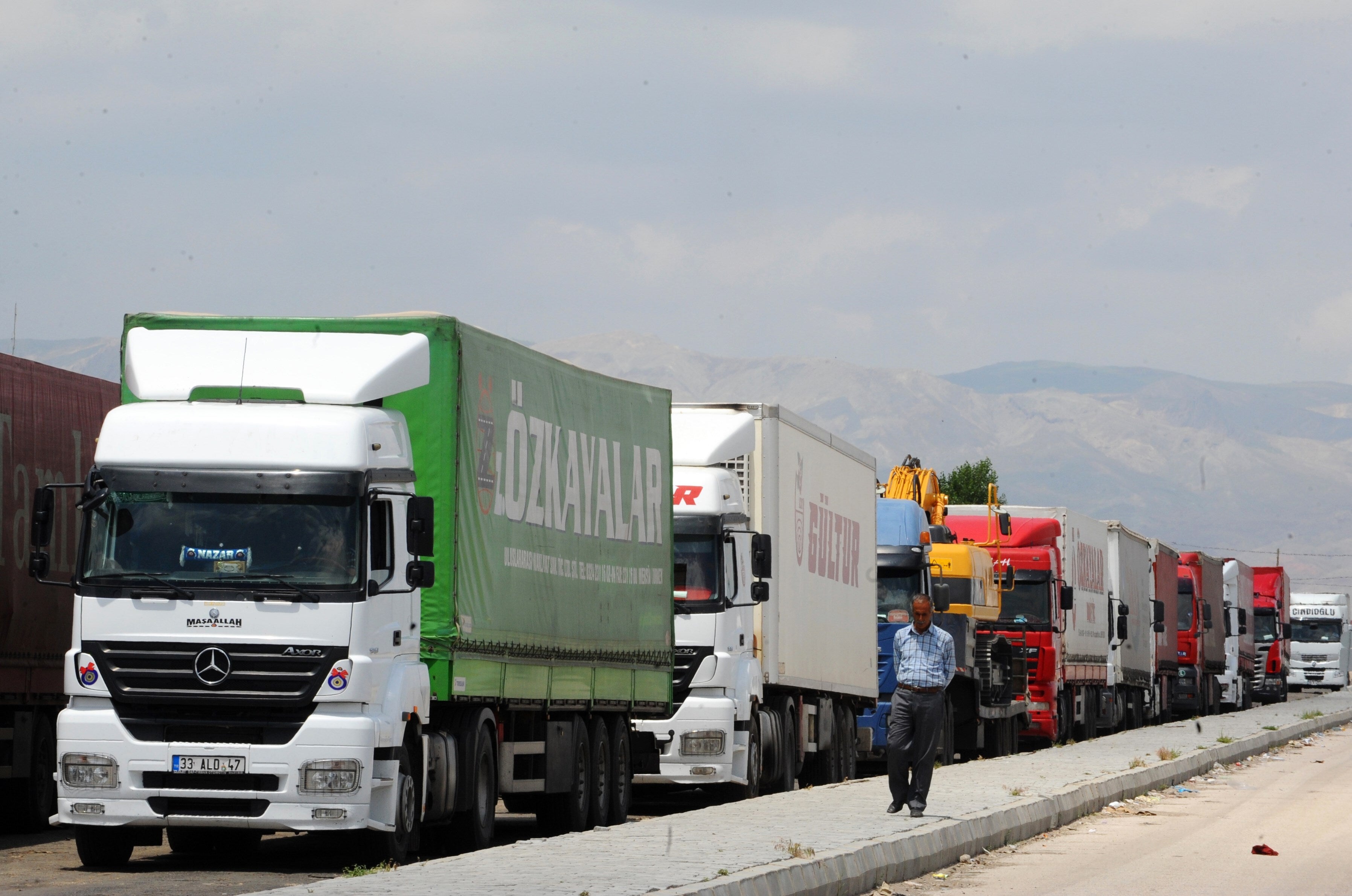 <p>Trucks waiting to cross into Iran from the Turkish side of the border near the Gurbulak border crossing</p>