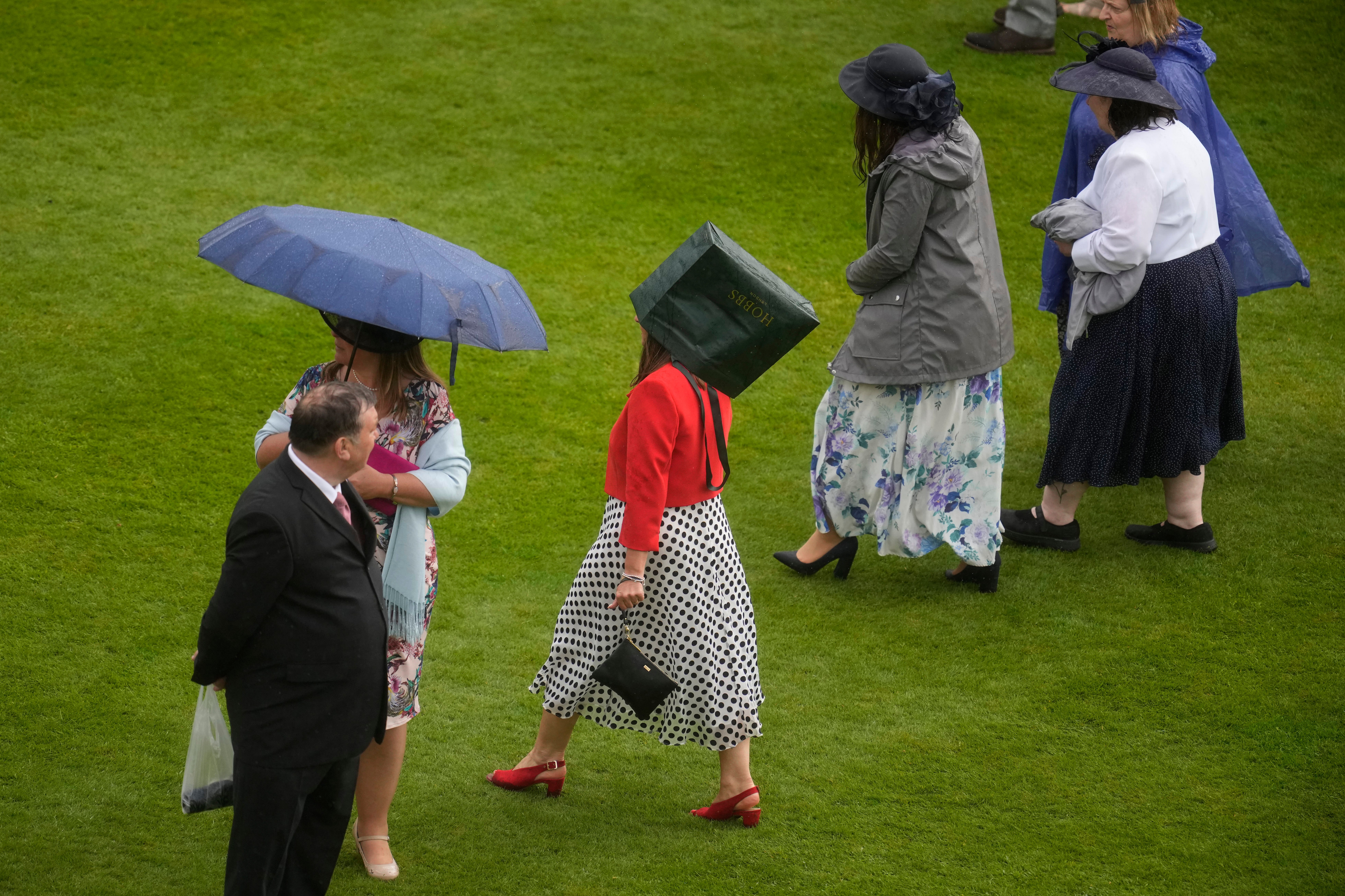 Rain likely over the weekend. Pictured: Garden party at Buckingham Palace on Wednesday