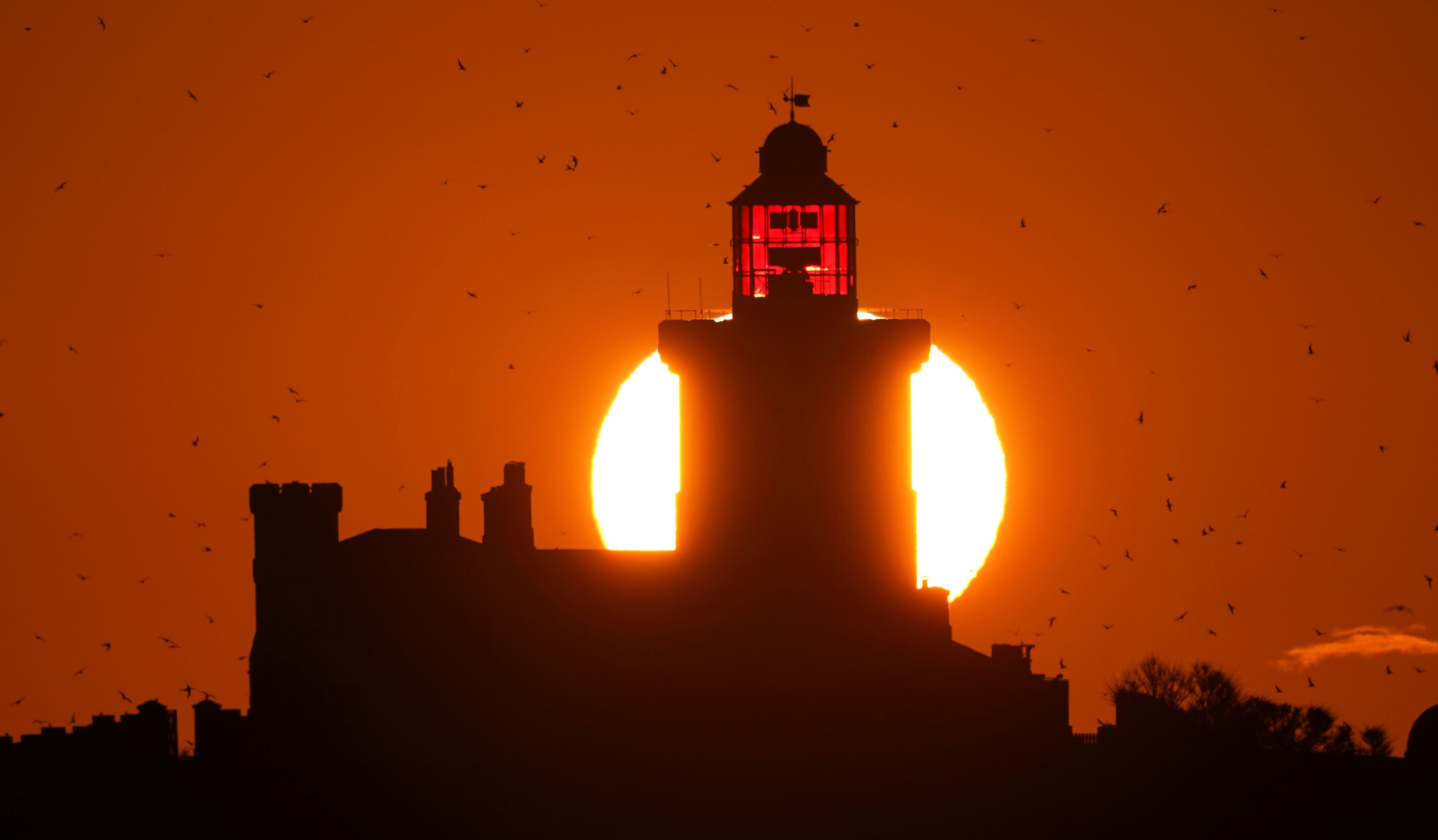 Sun rises over Coquet Island off Northumberland coast on Thursday