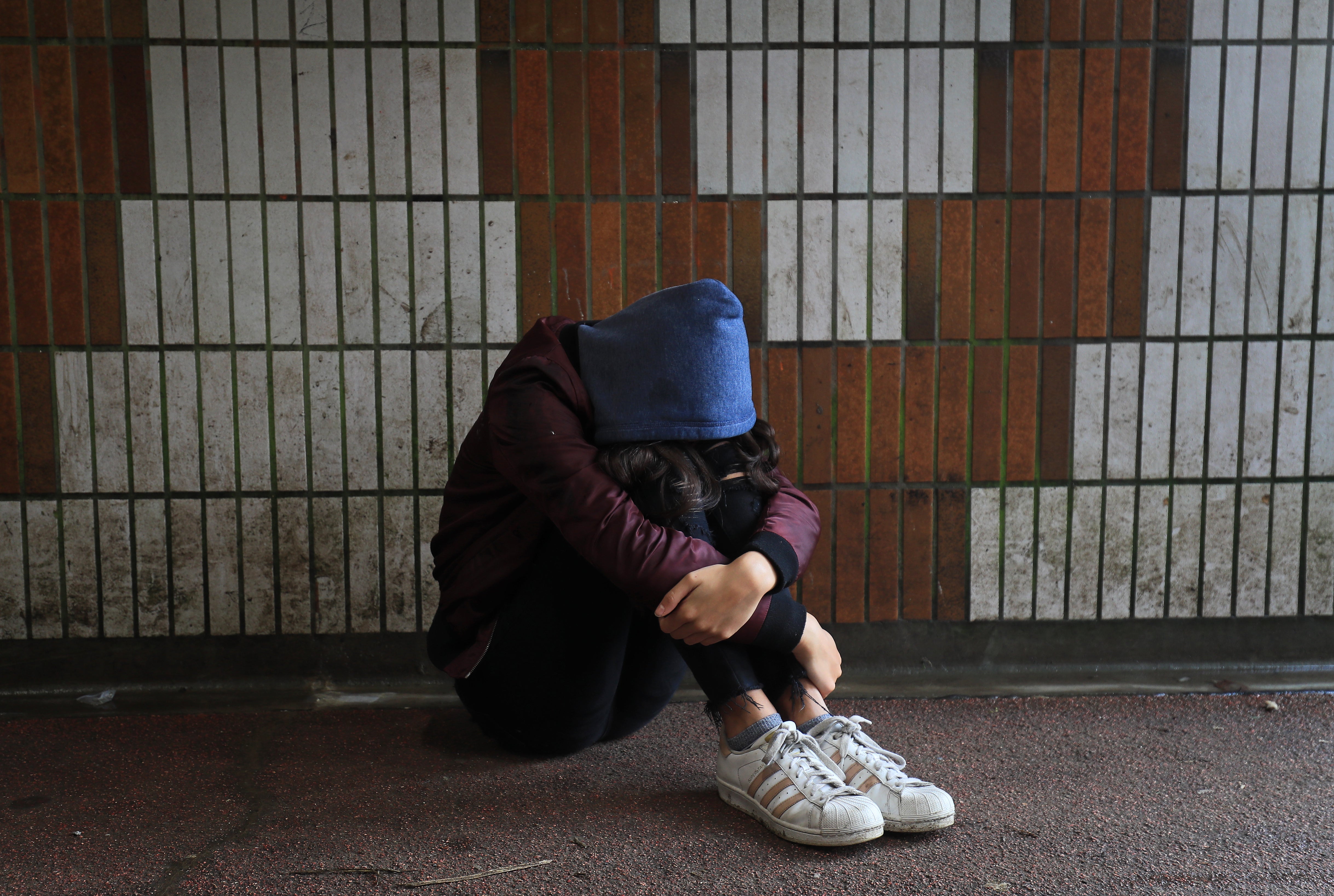 Picture posed by a model of a teenage girl showing signs of mental health issues (PA)