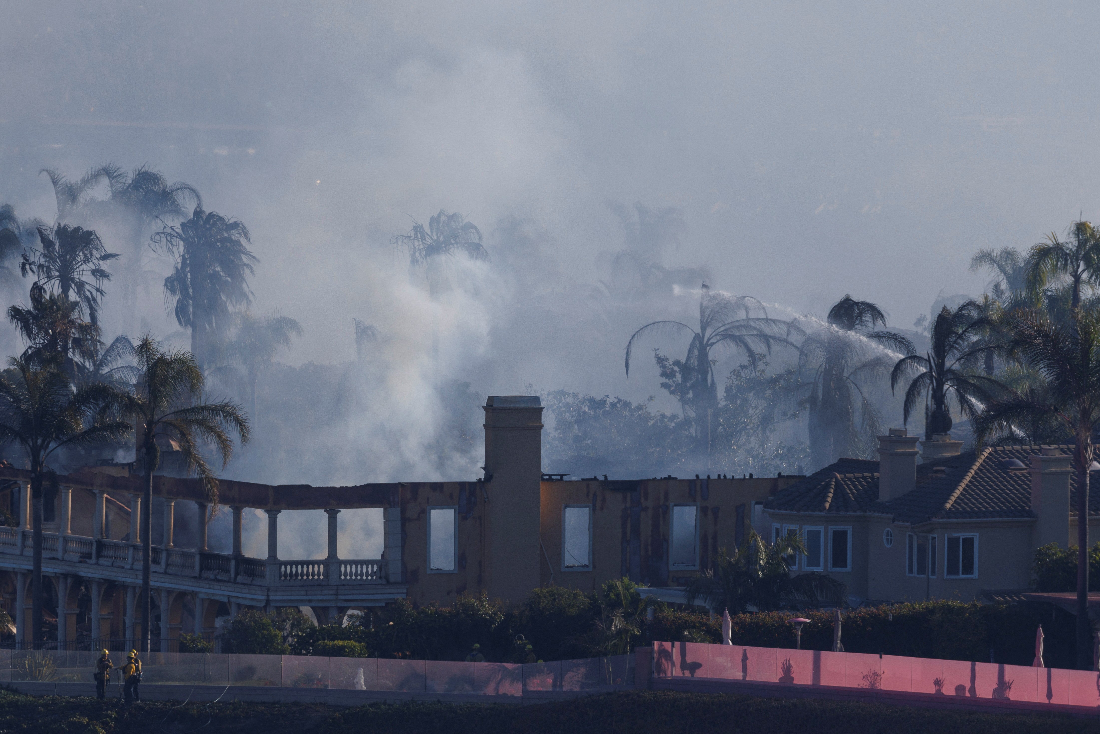 The remains of a large home that burned, seen on Thursday