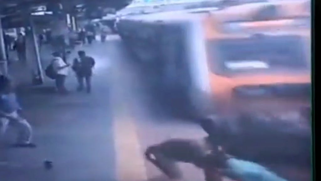 India: Police officer drags man from railway tracks seconds before train passes through