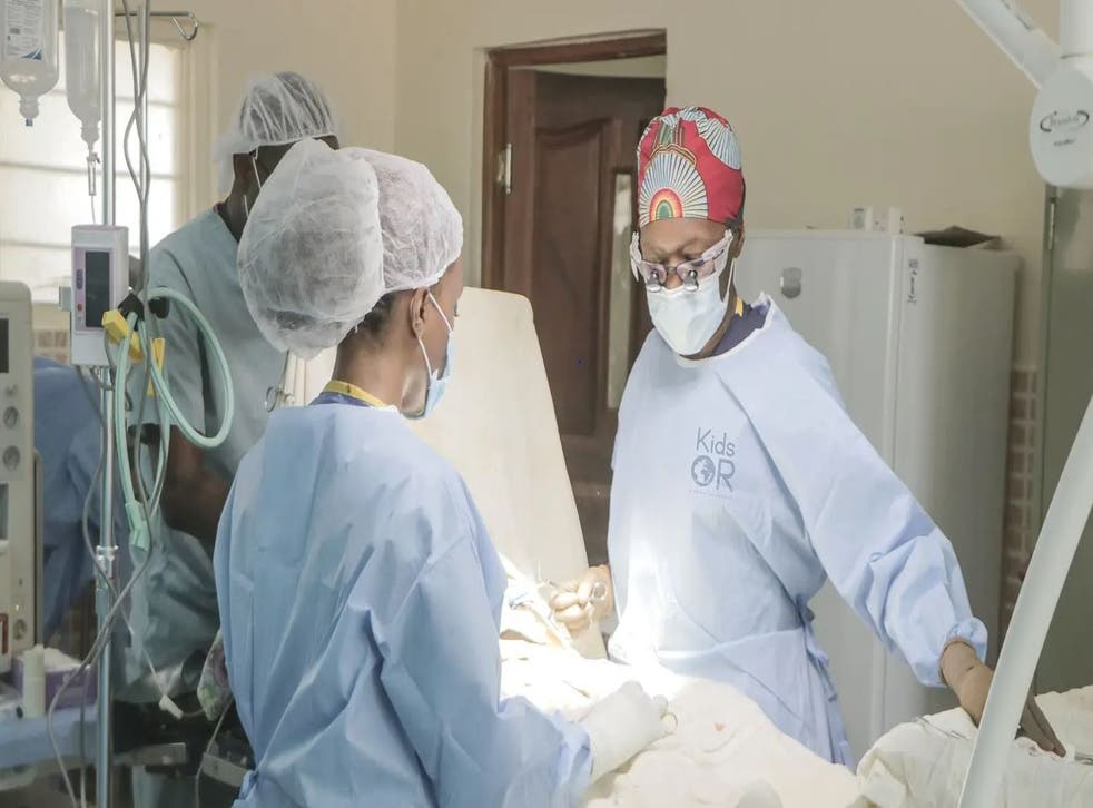 Dr Neema Kaseje, right, and a surgical team working in a KidsOR (Kids Operating Room (KidsOR)/PA)