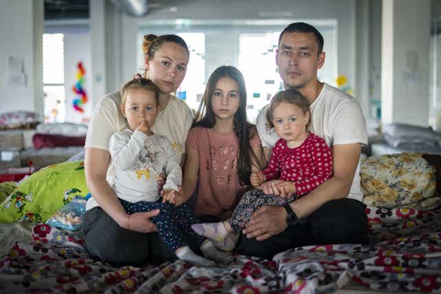 (not real names) Ukrainian refugees Elena Sidorova, her husband Vladimir, and their daughters Polina, Eva and Zlata (Kirsty O’Connor/PA)