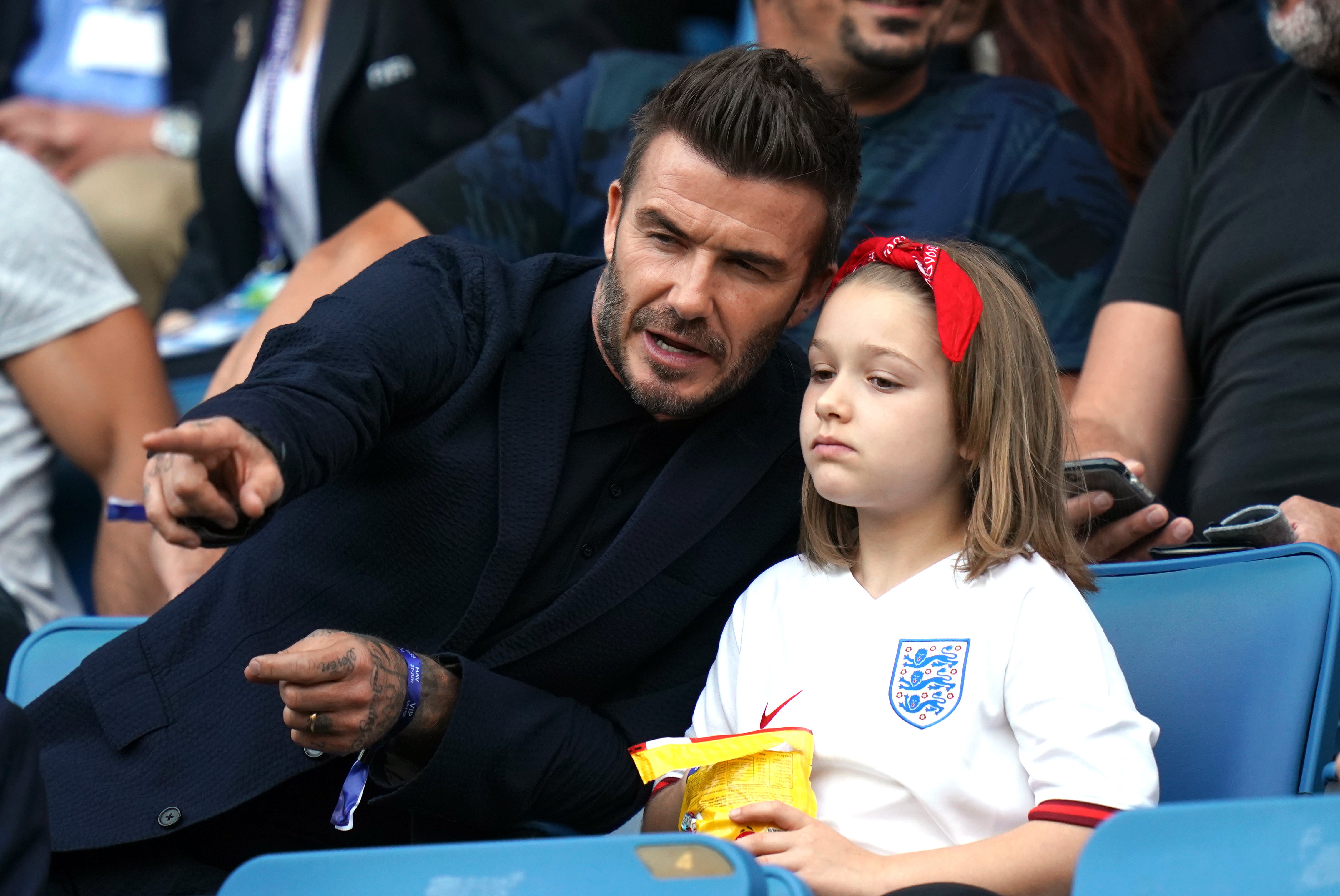 David Beckham alongside his daughter Harper