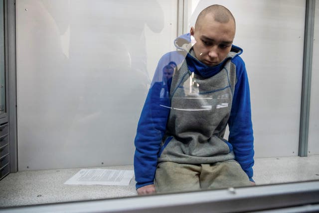 <p>Russian soldier Vadim Shishimarin, 21, suspected of violations of the laws and norms of war, sits inside a defendants’ cage during a court hearing, amid Russia's invasion of Ukraine, in Kyiv</p>