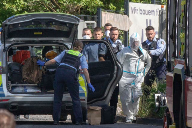 <p>Germany’s interior minister said the suspect, pictured in a full body suit, was already known to authorities </p>
