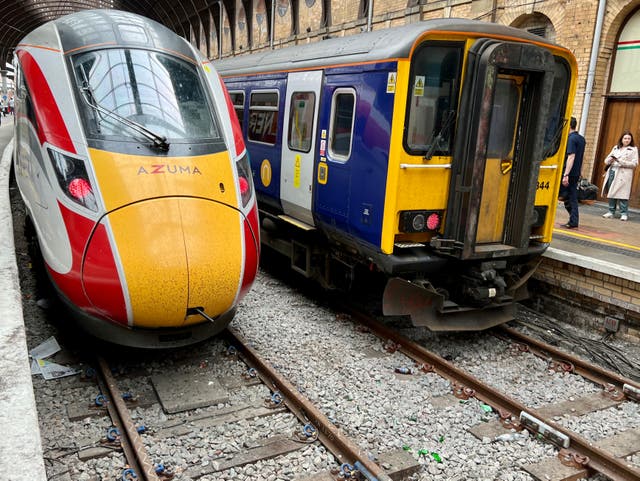 <p>Departing soon? LNER and Northern trains at York station. RMT members in both train operators have voted to strike </p>