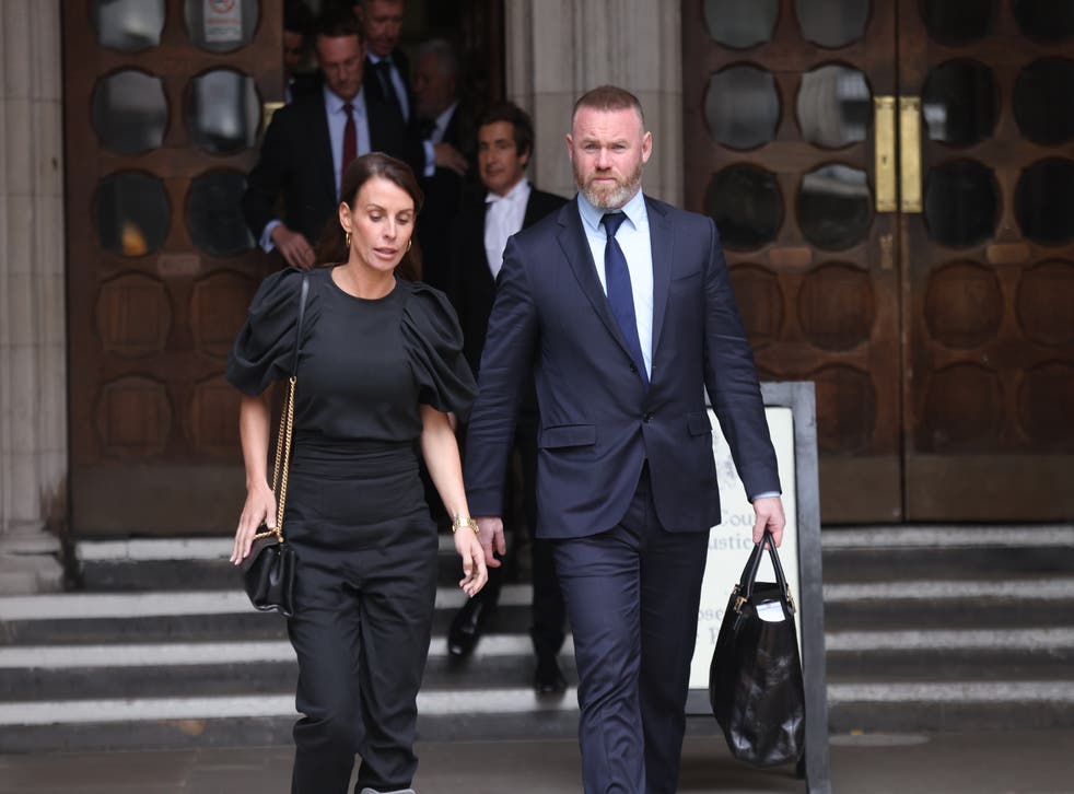 Coleen and Wayne Rooney leave the Royal Courts Of Justice (James Manning/PA)