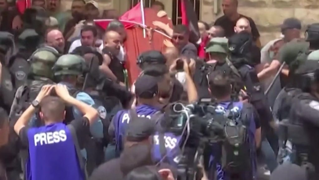 Shireen Abu Akleh’s coffin dropped amid clashes at journalist’s funeral