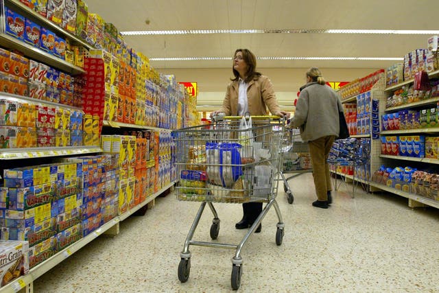 <p>Shoppers in a supermarket aisle</p>