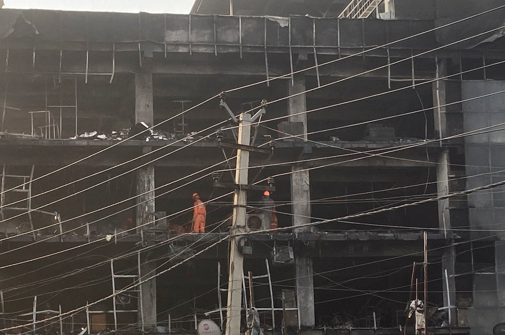 Police arrest 2 after building fire kills 27 in New Delhi