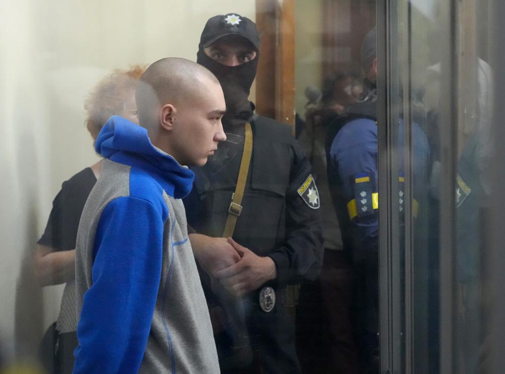 Russian army Sergeant Vadim Shishimarin, 21, is seen behind a glass during a court hearing in Kyiv, Ukraine