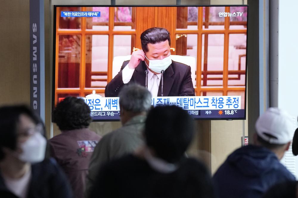 People watch a TV screen showing a file image of North Korean leader Kim Jong Un during a news program at a train station in Seoul, South Korea