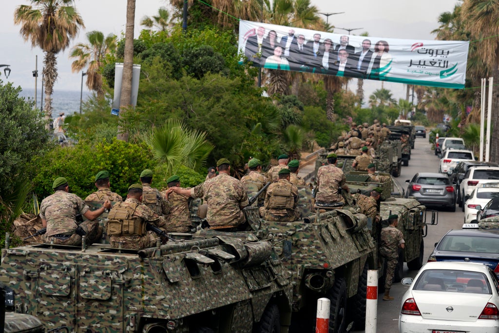 Mired in crises, Lebanese begin voting for new parliament