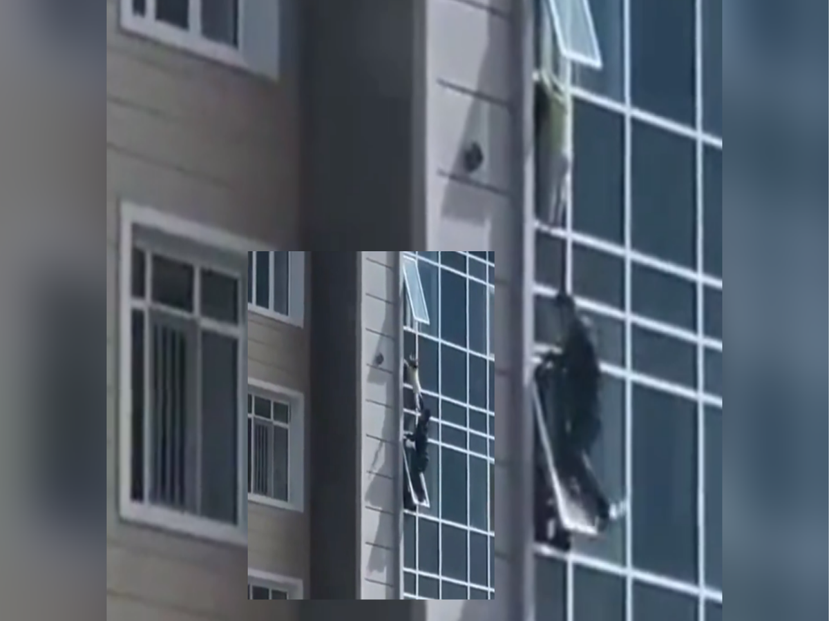 Watch: Man climbs out of window to rescue toddler hanging from 8th floor in  Kazakhstan