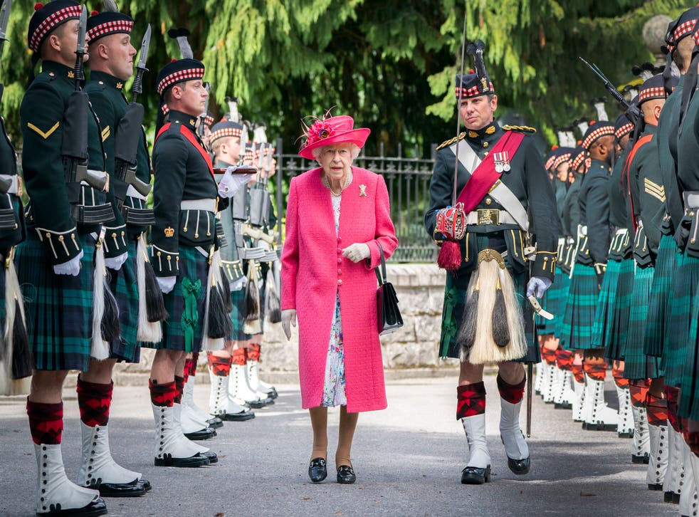 <p>The Queen inspecting the Balaklava Company, a Scottish military division, at Balmoral in August </p>