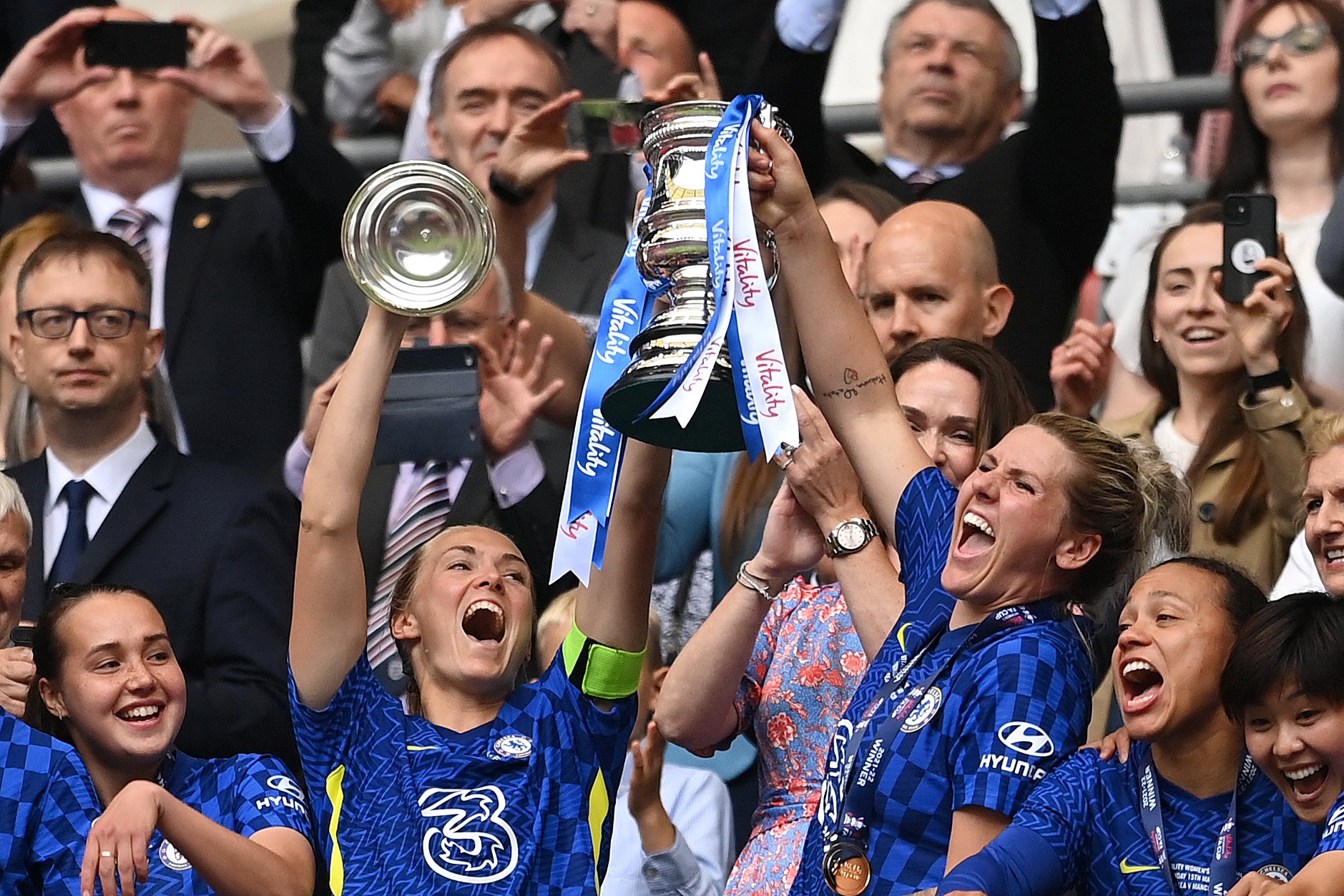 Magdalena Eriksson and Millie Bright of Chelsea lift the Vitality Women’s FA Cup trophy on Sunday