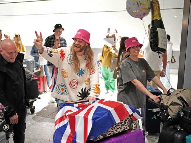<p>Sam Ryder arrives at Heathrow Airport after finishing second in the final of the Eurovision Song Contest in Italy (Dominic Lipinski/PA)</p>