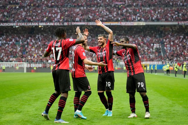 AC Milan celebrate moving one win away from the Serie A title (Antonio Calanni/AP)