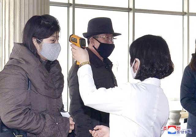 <p>File: Volunteers carry out temperature screening during an anti-virus campaign in Pyongyang, North Korea</p>