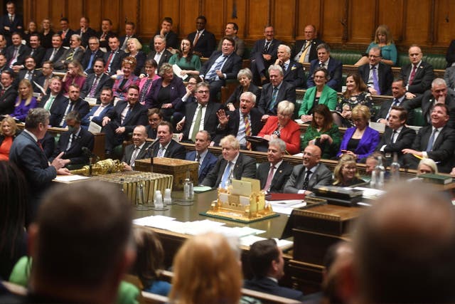 <p>Conservative MPs sitting while Labour leader Sir Keir Starmer stands to address PM Boris Johnson at Prime Minister’s Questions  </p>
