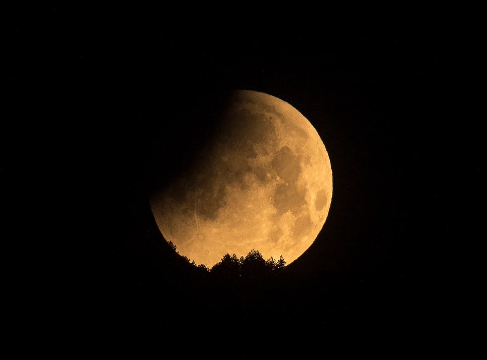 <p>The moon is seen during a penumbral lunar eclipse in Skopje, on 16 May 2022</p>