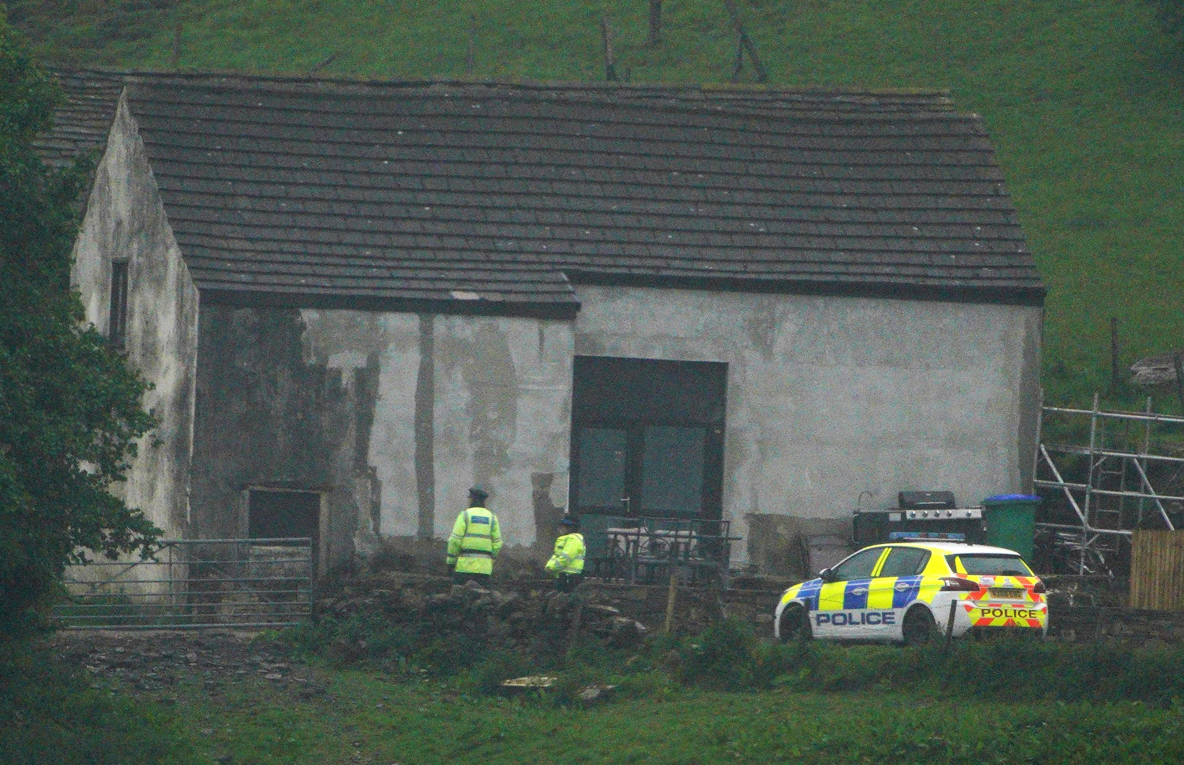 Police at a building in Milnrow, Rochdale after a three-year-old boy died after a suspected dog attack