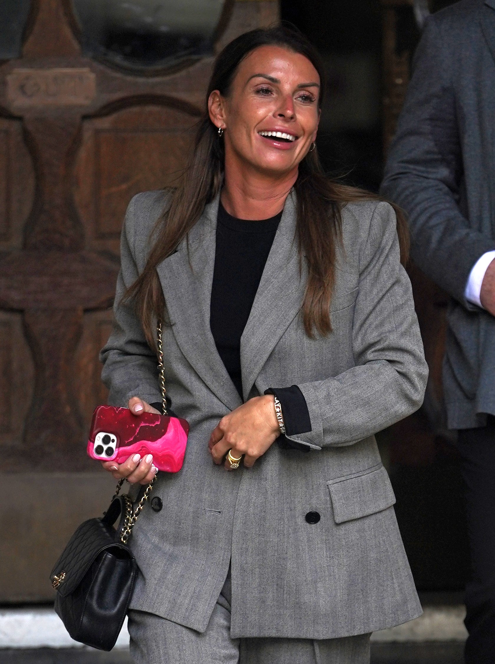 Coleen Rooney leaves the Royal Courts of Justice (Yui Mok/PA)