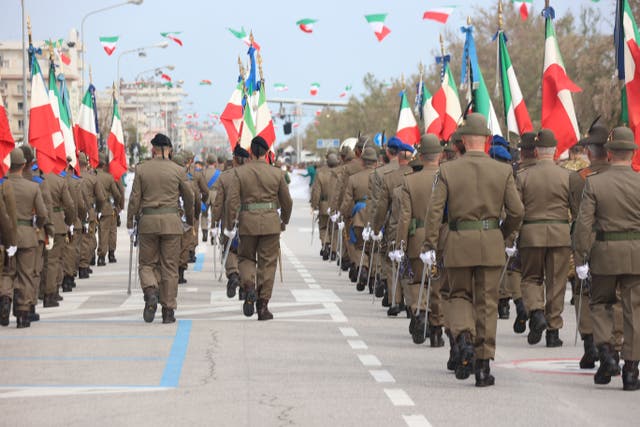 <p>Veterans march at this year’s  Alpini gathering in Rimini </p>