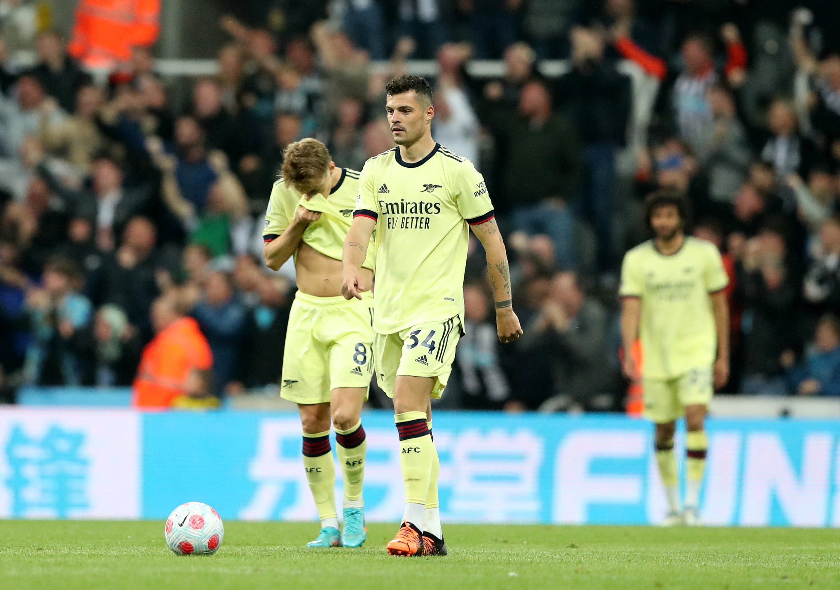 <p>A dejected Granit Xhaka walks away after Gabriel’s own goal </p>